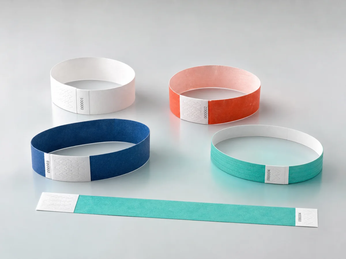 Thin numbered paper and synthetic resort day-pass wristbands